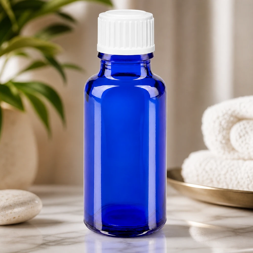 Kleine blaue Glasflasche 20ml mit kindersicherem weißen Verschluss für Öle