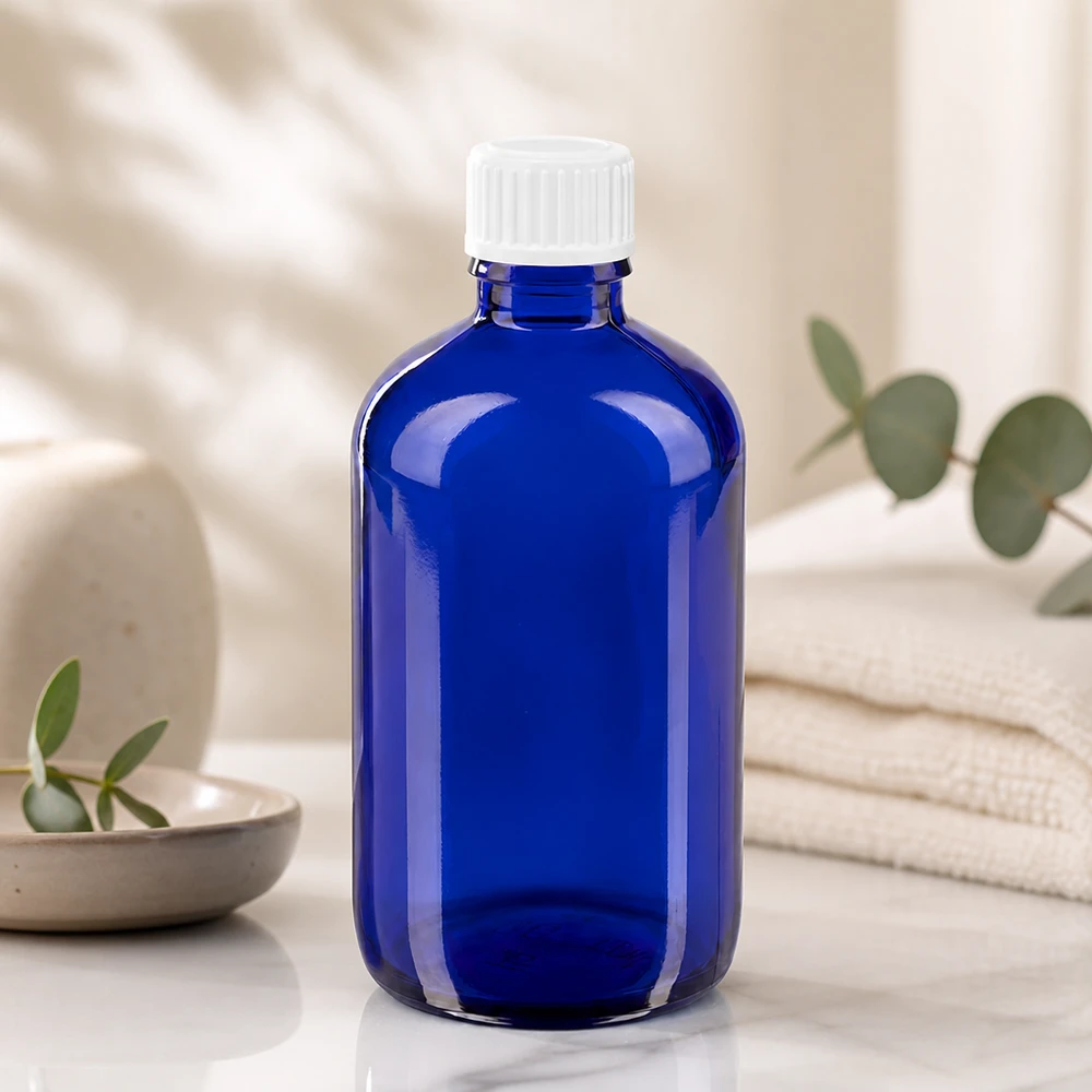 ApoGlas 100ml Flasche in Blau mit präzisem 0.9mm Tropfeinsatz für genaue Dosierung