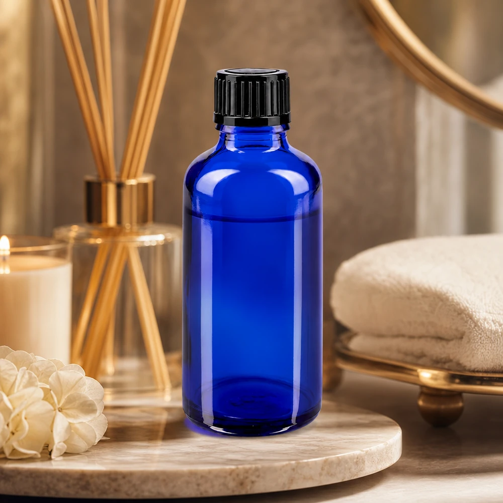Zylindrische blaue Glasflasche 50ml mit 1mm Dosieröffnung und geripptem Schwarzdeckel