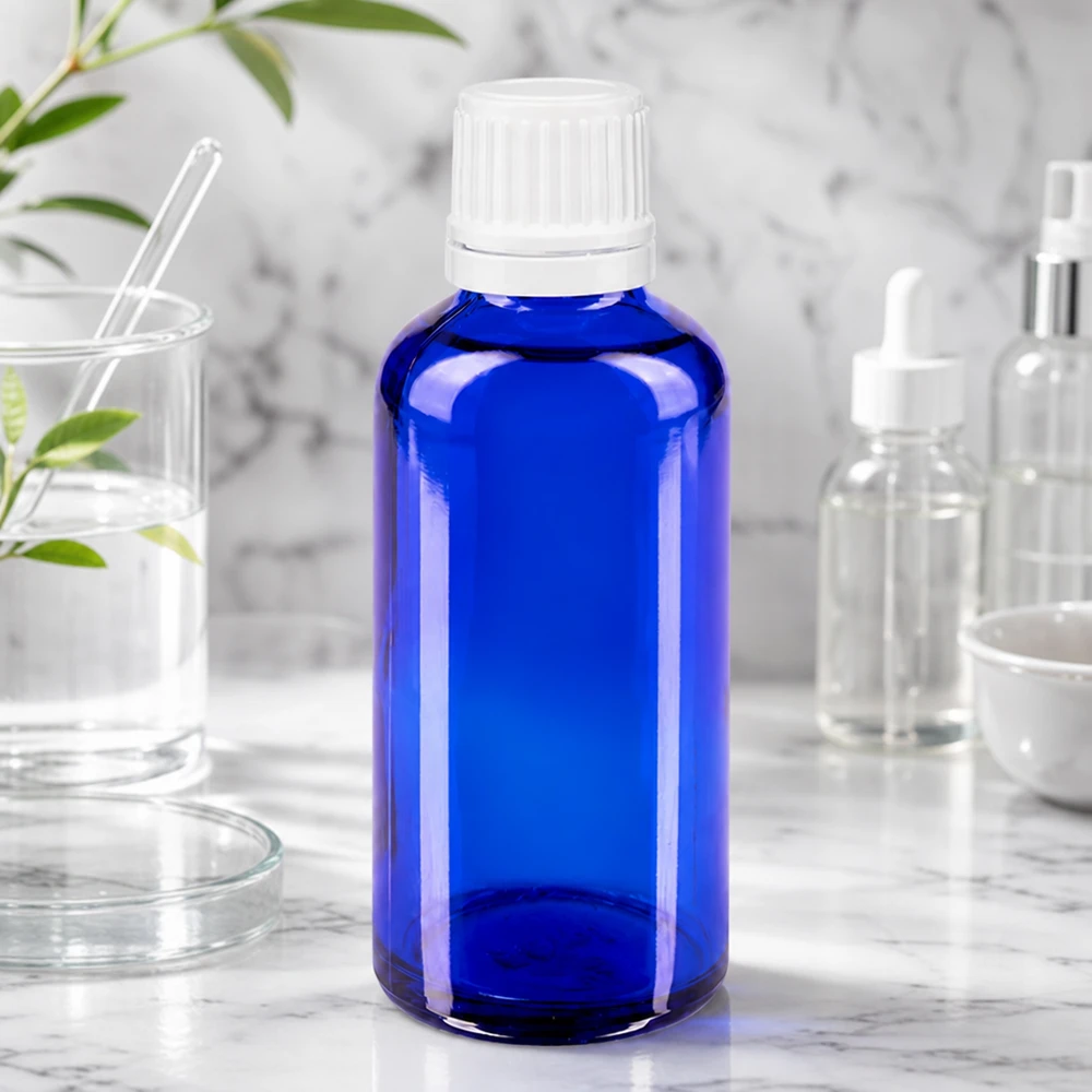Blaue 50ml Flasche aus UV-Schutzglas mit weißem Originalverschluss für Tinkturen und Essenzen