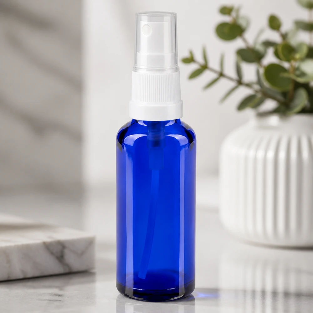 Kleine blaue Lichtschutz Sprayflasche aus Glas mit transparenter Kappe 30ml